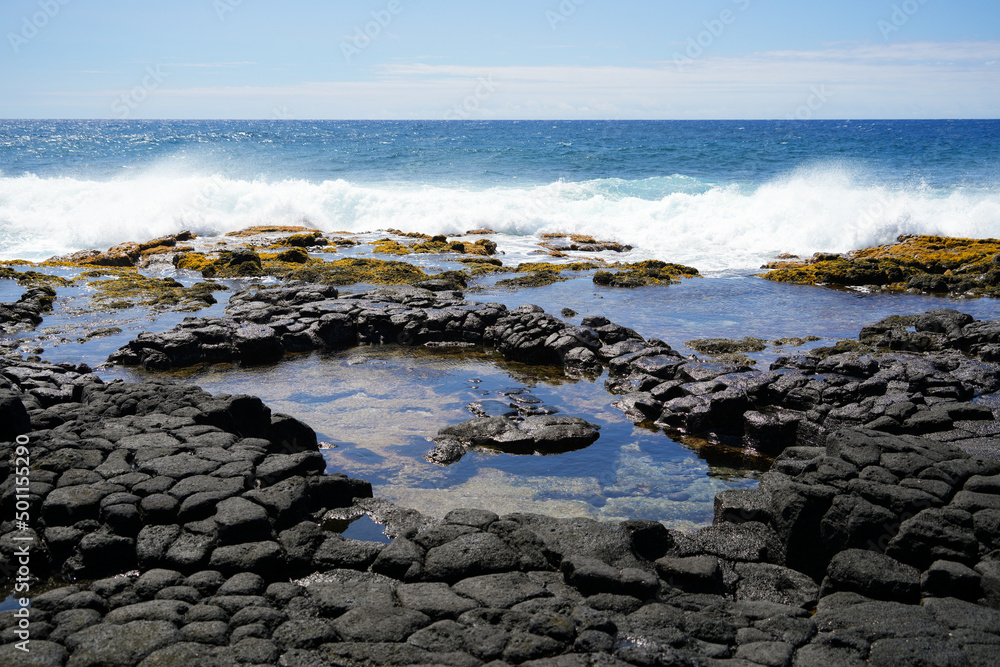 Tide pools on columnar jointed volcanic lava rock in South Point Park, the southernmost point of the United States on the Big Island of Hawaii in the Pacific Ocean Tide pools on columnar jointed volcanic lava rock in South Point Park, the southernmost point of the United States on the Big Island of Hawaii in the Pacific Ocean