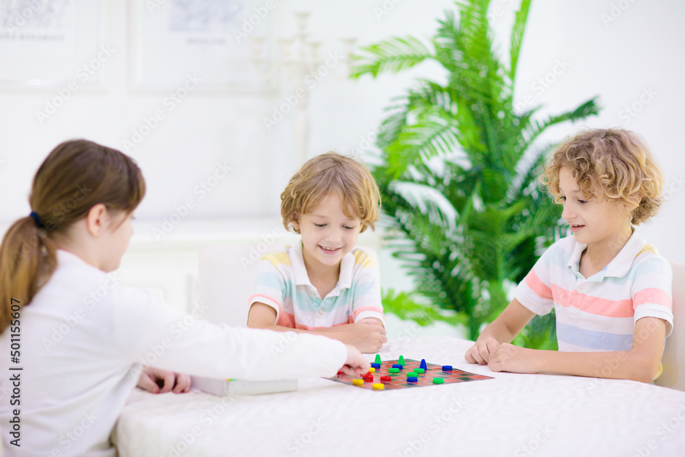Family playing board game. Kids play. Family playing board game. Kids play.