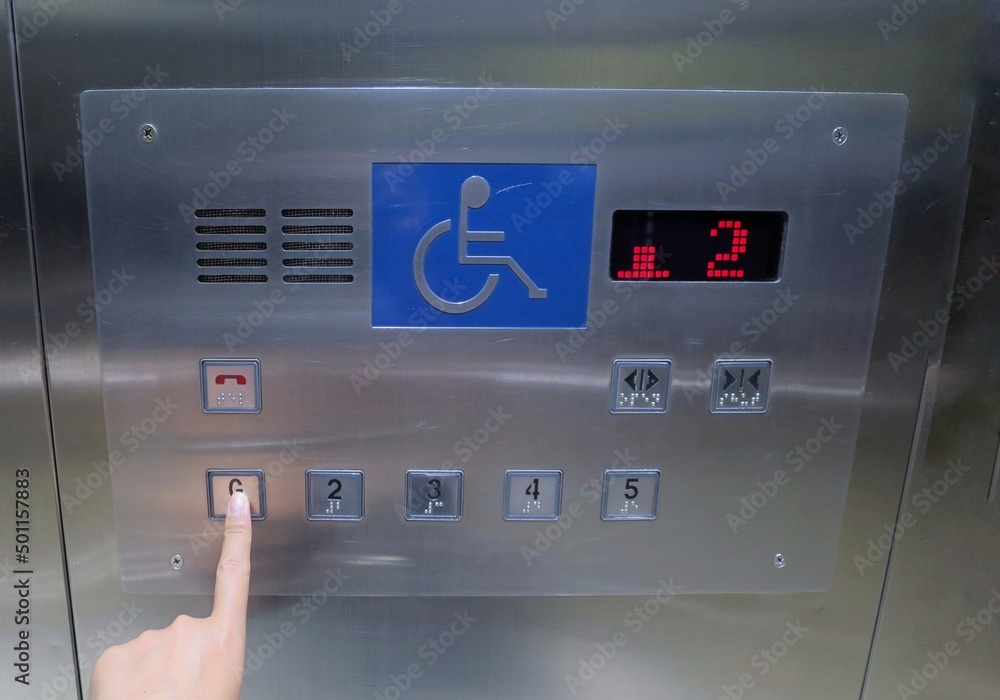 The elevator button with braille code of the elevator. Universal design