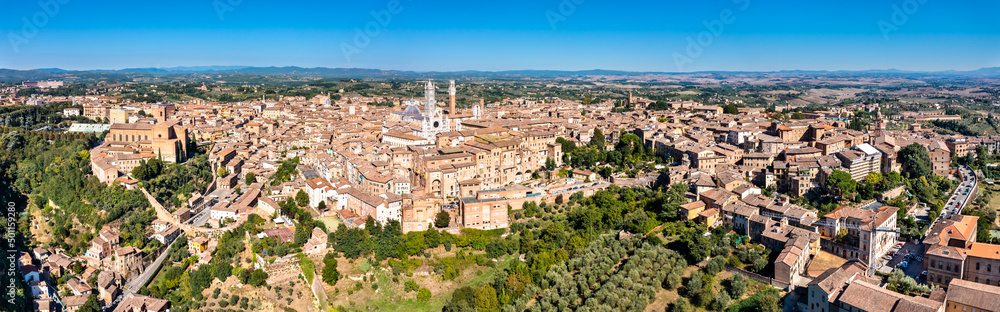 Aerial view of Siena with the Cathedral and the Mangia Tower. UNESCO world heritage in Tuscany, Italy