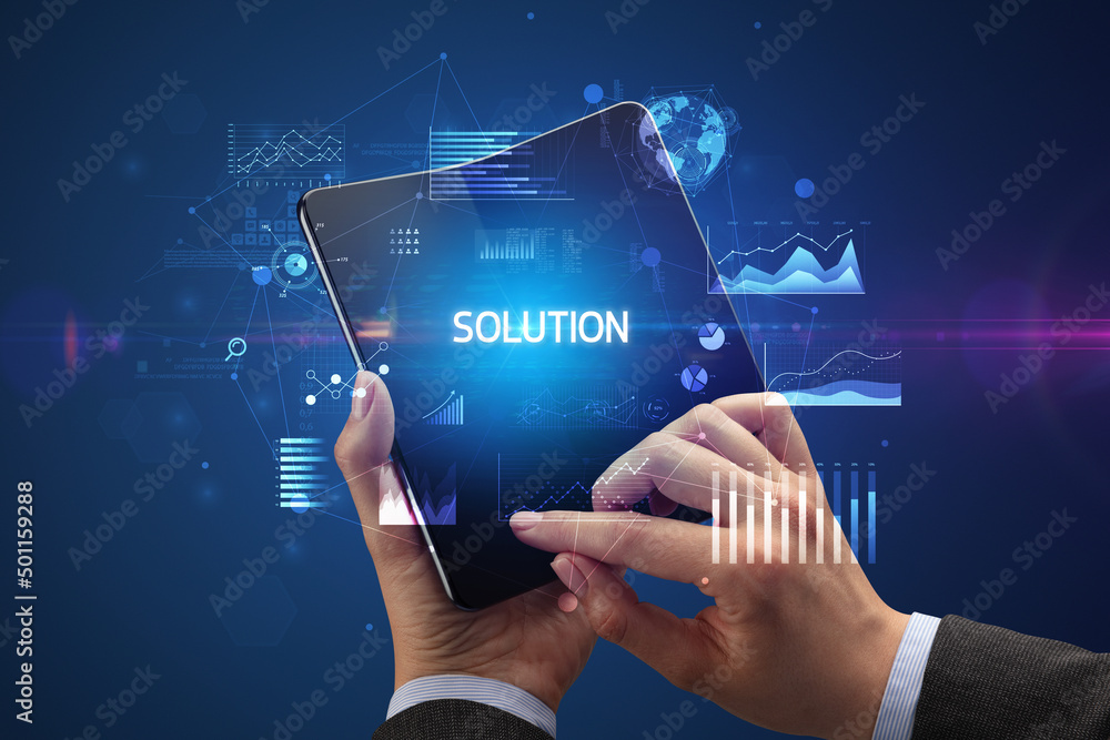 Businessman holding a foldable smartphone, business concept Businessman holding a foldable smartphone, business concept