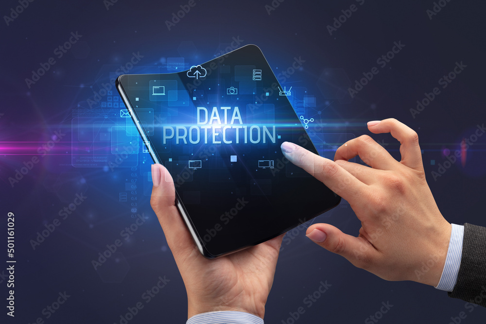 Businessman holding a foldable smartphone, security concept Businessman holding a foldable smartphone, security concept