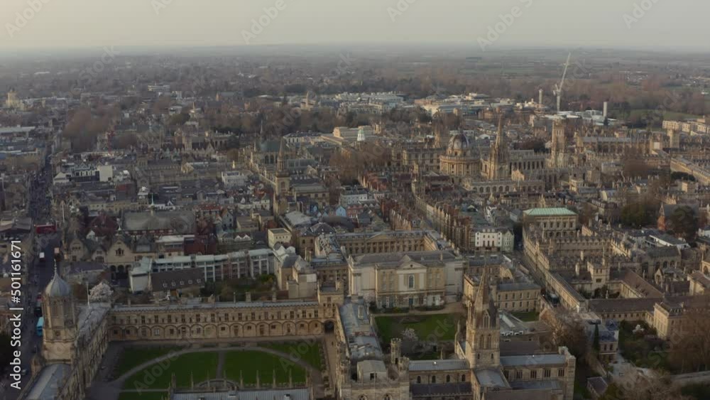 Dolly forward drone shot over Christ church and bodleian library Radcliffe camera Oxford Golden hour Dolly forward drone shot over Christ church and bodleian library Radcliffe camera Oxford Golden hour