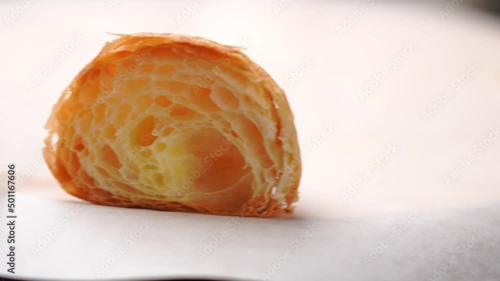 closeup of Cut freshly crispy croissant rotation in slow motion for an appetizing breakfast. Homemade bakery ready to eat. closeup of Cut freshly crispy croissant rotation in slow motion for an appetizing breakfast. Homemade bakery ready to eat.