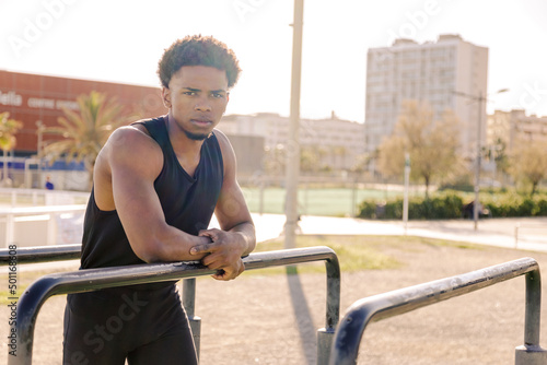 Strong guy. Calisthenics guy portrait. Outdoor training and working out.