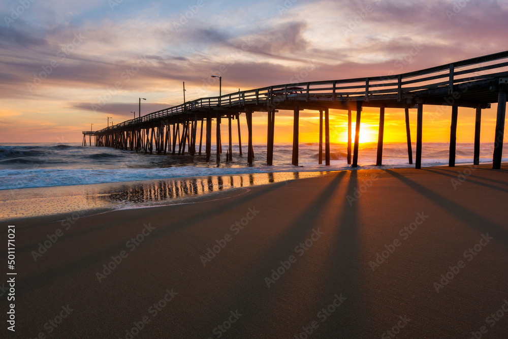 Sunrise behind fishing pier along North Carolina's Outer Banks