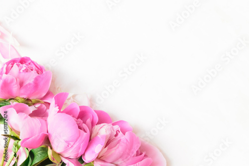 Abstract Border of Beautiful pink and white peony flowers with copy space for your text top view and flat lay style © Halina