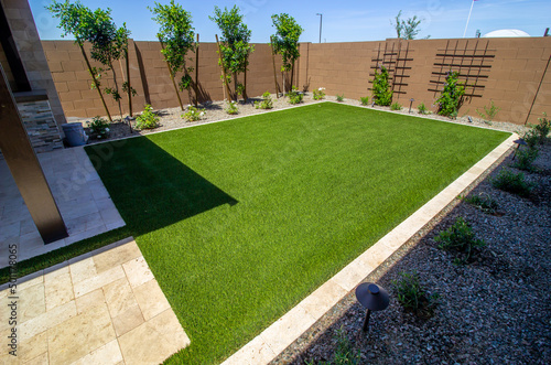 Landscaped Rear Yard Setting With Grass