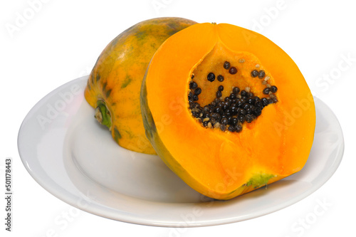 One yellow juicy cut papaya (Carica papaya) fruit isolated on white background
