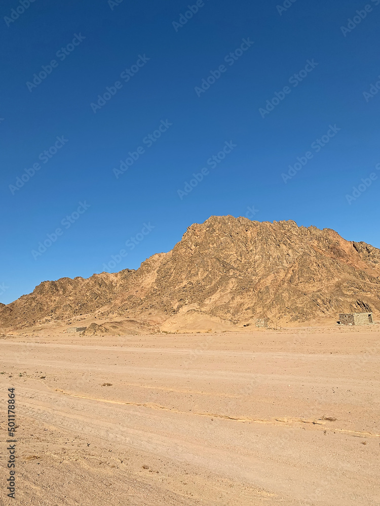 Beautiful small canyon with red sandstone rocks and sand, Nabq protected area, Sharm El Sheikh, Sinai peninsula, Egypt, North Africa. Egyptian safari Beautiful small canyon with red sandstone rocks and sand, Nabq protected area, Sharm El Sheikh, Sinai peninsula, Egypt, North Africa. Egyptian safari