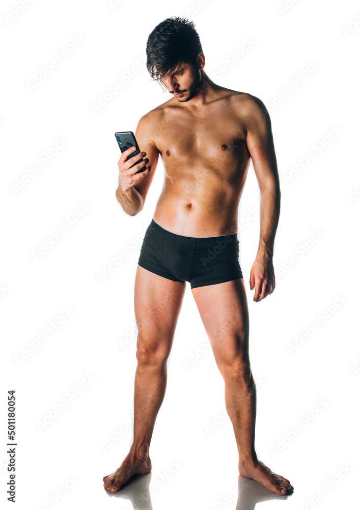 Cheerful young man in trunks over white background Cheerful young man in trunks over white background
