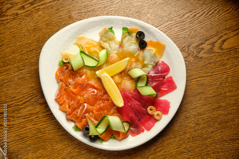 Slices of salted salmon with pepper and vegetables Slices of salted salmon with pepper and vegetables