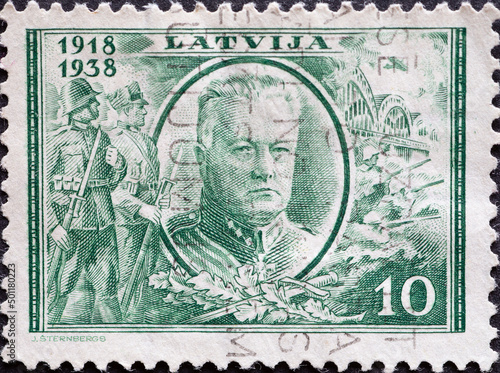 Latvia - circa 1938: a postage stamp from Latvia , showing a portrait of President Kārlis Ulmanis (1877-1942) photo