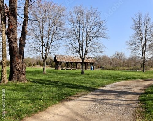 The wood shelter in the park on a sunny day.