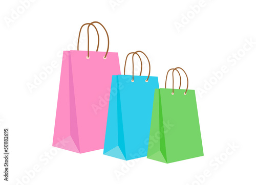 Three colorful shopping bags are on an isolated background. They are pink, blue and green