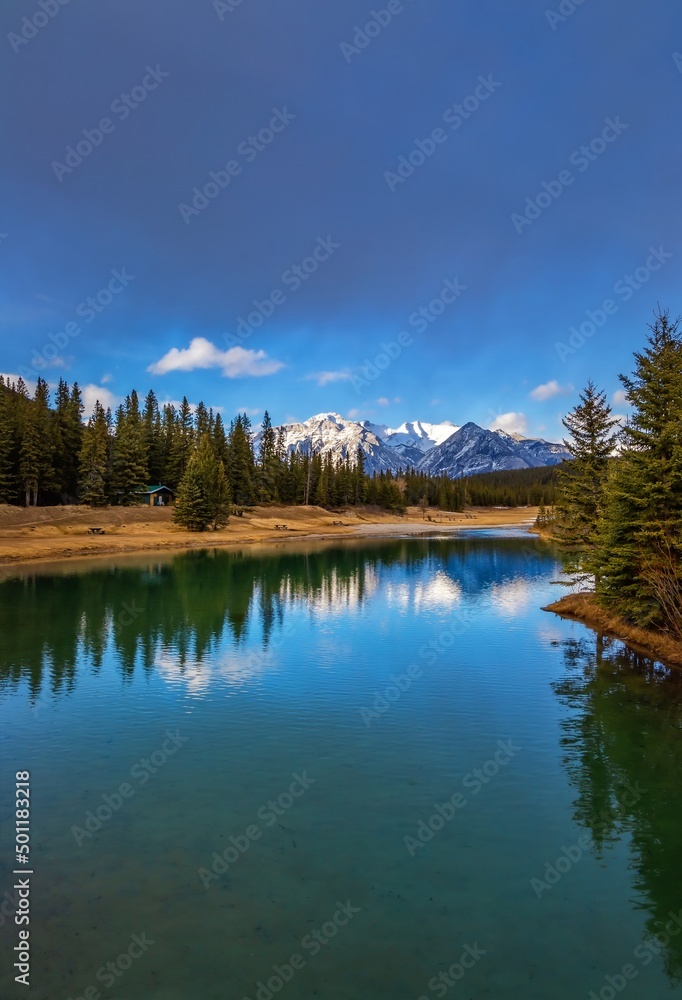 Mountain Reflections On A Calm Banff Lake