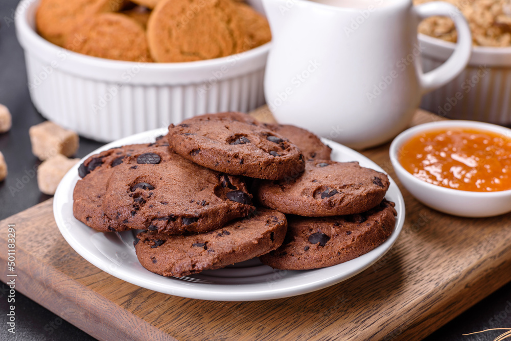 Fototapeta premium Delicious nutritious healthy breakfast with granola, eggs, oat cookies, milk and jam