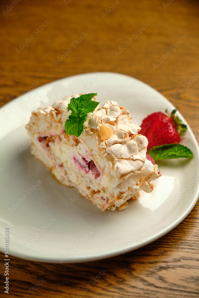 Cake with meringue roll with cream and raspberries Cake with meringue roll with cream and raspberries