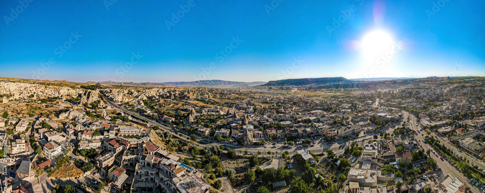 Aerial photos of the city of Goreme in Cappadocia, Turkey, with a sunny day and clear of clouds, mountain and rocks formation