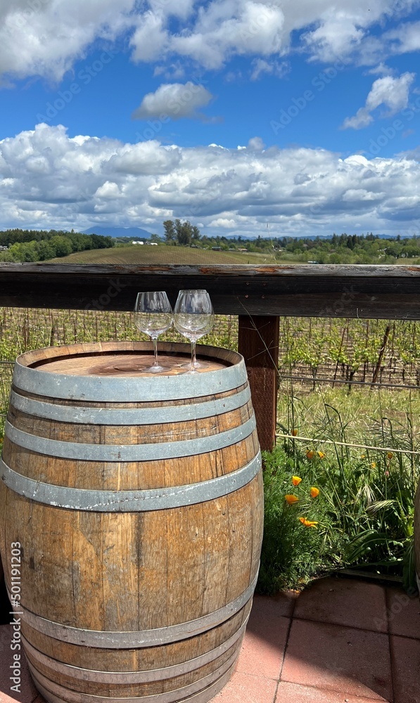 old wine barrel with wine glasses, in a vineyard old wine barrel with wine glasses, in a vineyard