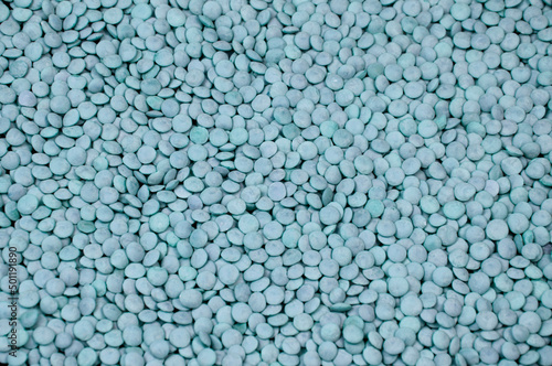 blue grainy background. turquoise seeds.