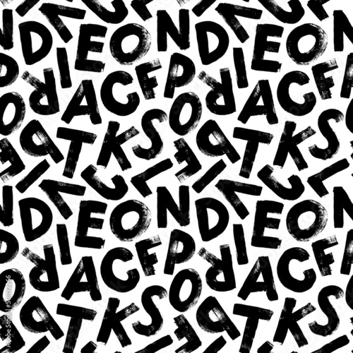 Vector seamless pattern with grunge letters of the alphabet in random order on a white background. Hand drawn grunge ink illustration. Handwritten latin letters. Black textured brush strokes.