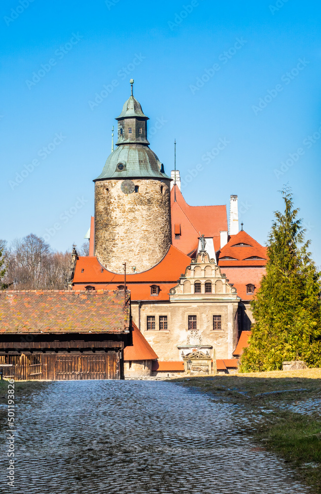 Beautiful Czocha castle in Lesna, Poland, front view in spring time on blue sky background. Lower Silesia architecture landscape.