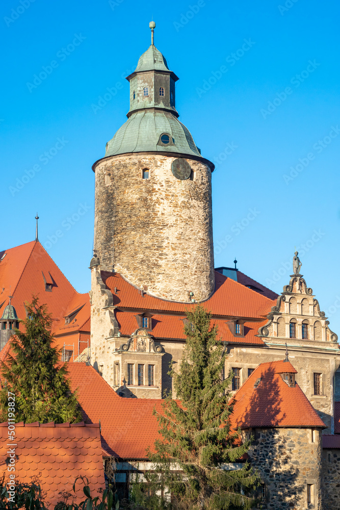 Beautiful Czocha castle in Lesna, Poland, front view in spring time on blue sky background.  Lower Silesia architecture landscape.