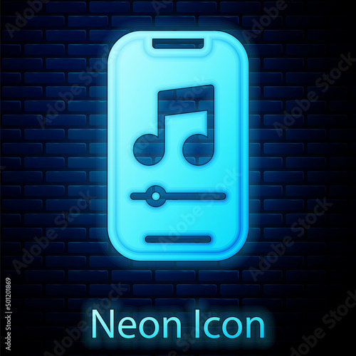 Glowing neon Music player icon isolated on brick wall background. Portable music device. Vector
