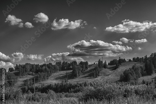 Dramatic summer black and white scenic with ski slopes photo