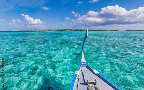 Amazing Maldives beach design. Maldives traditional boat Dhoni front. Perfect blue sea with ocean lagoon. Luxury tropical paradise concept. Beautiful vacation travel landscape. Tranquil ocean lagoon © icemanphotos