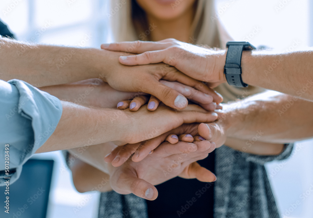 Business people teamwork stacking hands Business people teamwork stacking hands