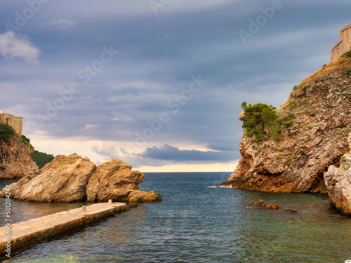 Dubrovnik, Croatia - August 28, 2021: View of the west harbor without tourists or rowboats while a storm approaches. This place appears in the TV series Game of Thrones.