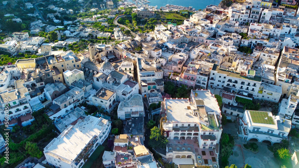 Aerial view of Capri homes and cityscape at summer sunset, Campania - Italy