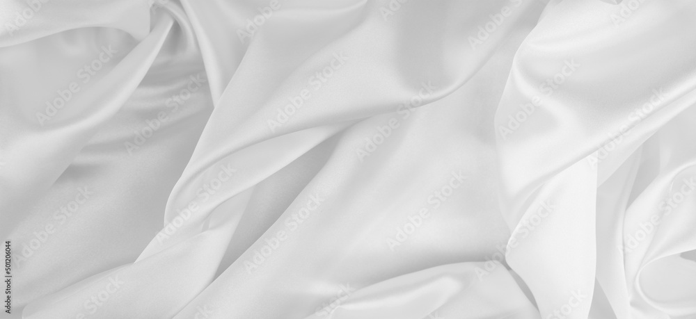 Close-up of rippled white silk fabric texture