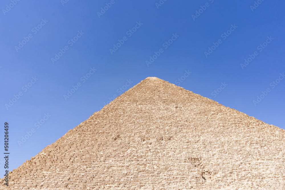 The Great Pyramid of Giza is a defining symbol of Egypt and the last of the ancient Seven Wonders of the World. The massive temple complex of Karnak was the principal religious center of the god Amun. The Great Pyramid of Giza is a defining symbol of Egypt and the last of the ancient Seven Wonders of the World. The massive temple complex of Karnak was the principal religious center of the god Amun.