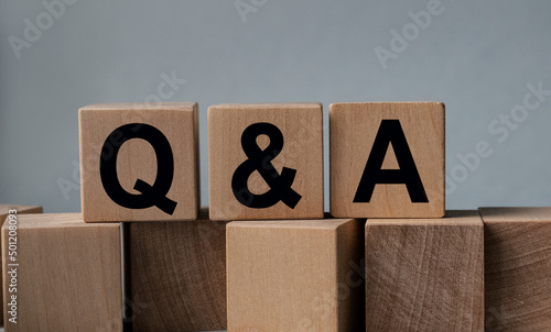 Q and A , the inscription on wooden cubes on a white background