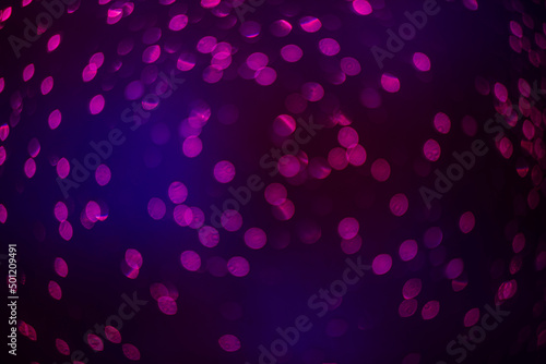 purple bokeh defocused glitter, abstract background with purple bokeh on a dark background