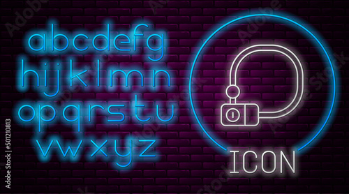 Glowing neon line Bicycle lock U shaped industrial icon isolated on brick wall background. Neon light alphabet. Vector