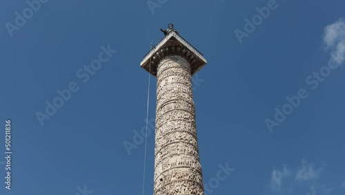 Time lapse of the Column of Marcus Aurelius located in the Piazza Colonna in Rome, Italy. photo