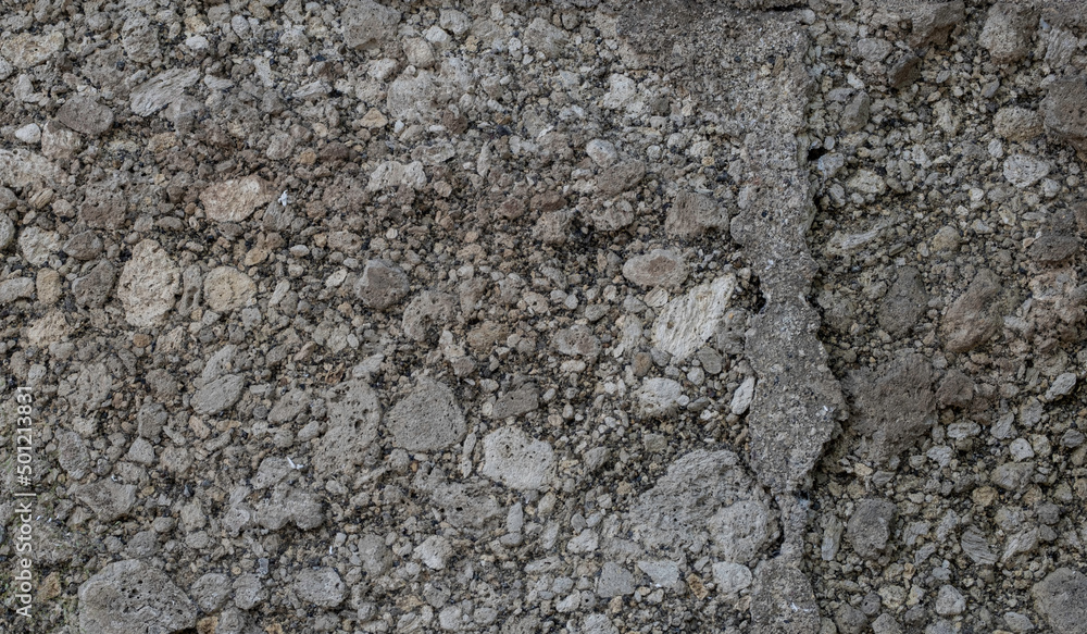Close up view of rumbling concrete wall texture Close up view of rumbling concrete wall texture