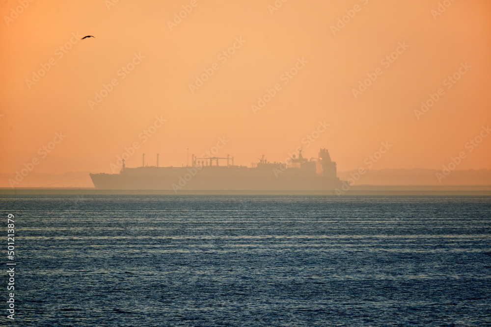 LNG vessel silhouette in polish harbour of Świnoujście