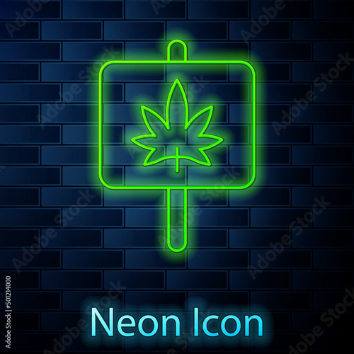 Glowing neon line Medical marijuana or cannabis leaf icon isolated on brick wall background. Hemp symbol. Vector
