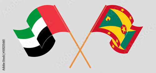 Crossed and waving flags of the United Arab Emirates and Grenada