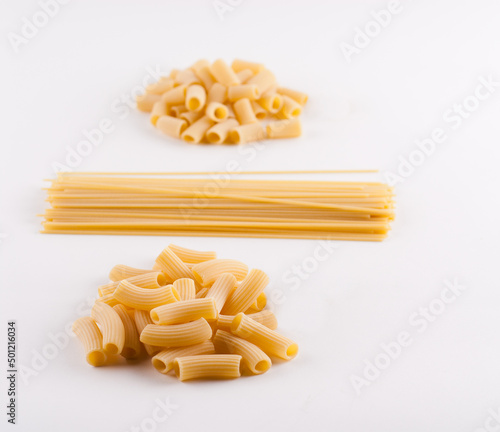Assorted types of pasta on white 
