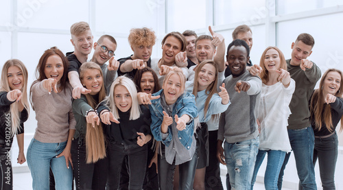 large group of happy young people showing their success