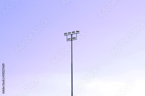 stadium lights against blue sky