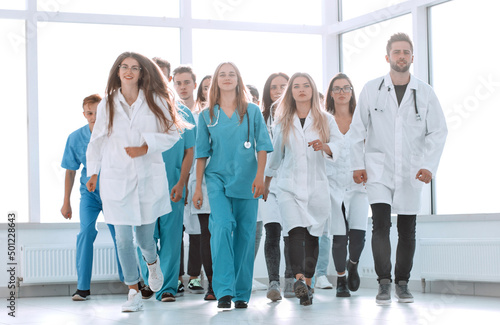 group of hilarious doctor interns showing thumbs up