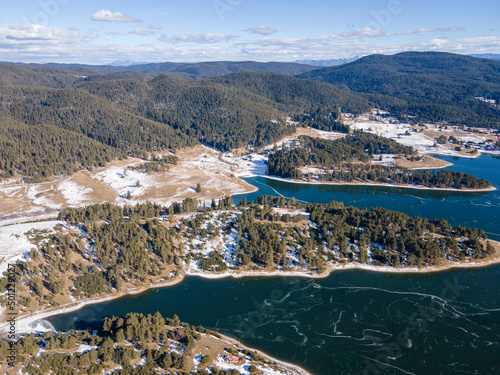 Aerial winter view of Dospat Reservoir covered with ice, Bulgaria © Stoyan Haytov