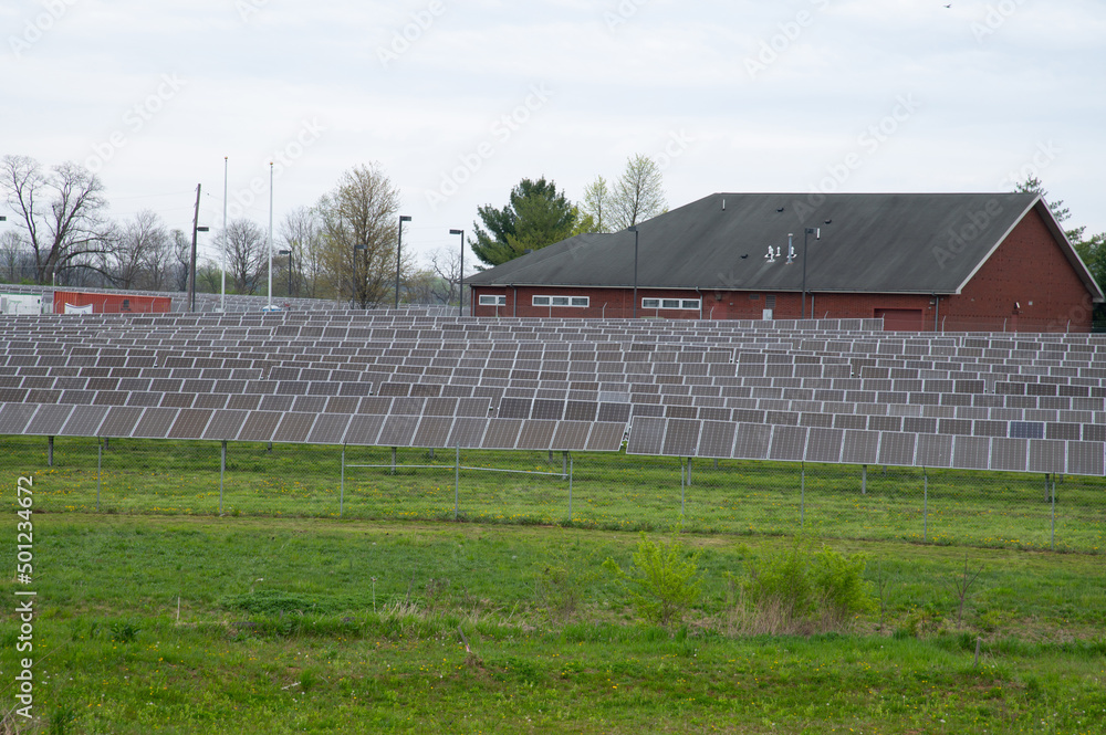 Many solar panels at the field horizontal orientation, gray panels Many solar panels at the field horizontal orientation, gray panels